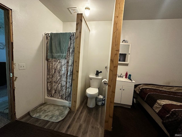 13687 E Ivan Ct, Bloomington, IN 47403 - full bath with vanity, wood finished floors, and a shower with shower curtain