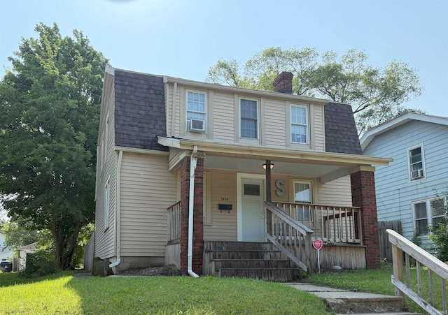 1814 S Douglas St, South Bend, IN 46613 - colonial inspired home featuring a chimney, a shingled roof, covered porch, and a front yard