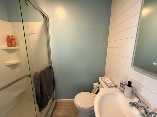 1814 S Douglas St, South Bend, IN 46613 - bathroom featuring a shower stall, wood walls, and wood finished floors