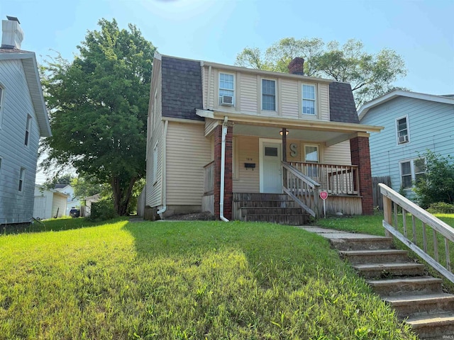 1814 S Douglas St, South Bend, IN 46613 - dutch colonial with roof with shingles, a porch, stairway, a front lawn, and a chimney