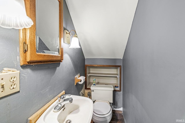 422 W Lawrence St, Mishawaka, IN 46545 - bathroom featuring toilet and lofted ceiling
