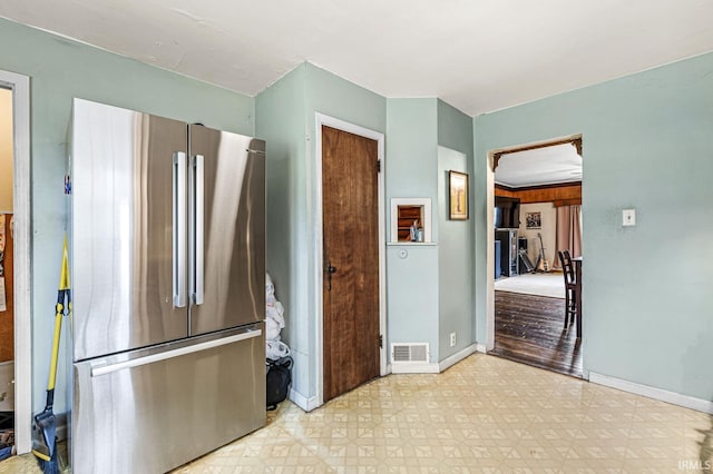 422 W Lawrence St, Mishawaka, IN 46545 - kitchen with freestanding refrigerator and light flooring