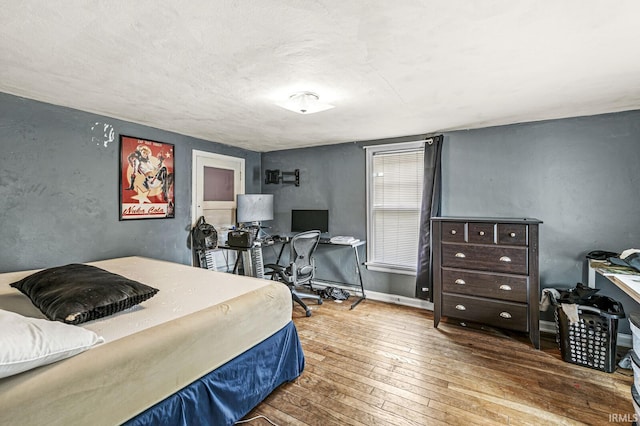 422 W Lawrence St, Mishawaka, IN 46545 - bedroom with wood-type flooring and an office area