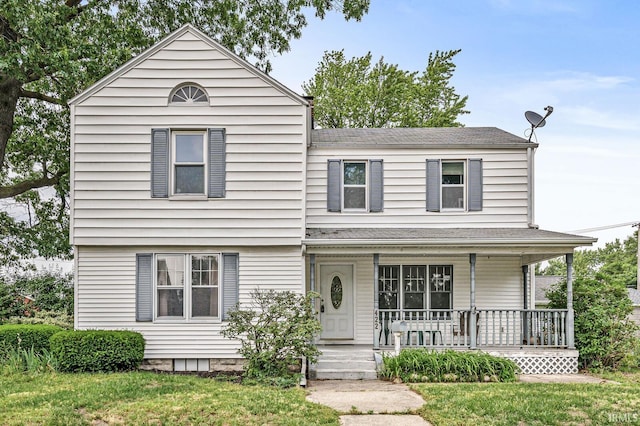 422 W Lawrence St, Mishawaka, IN 46545 - view of front of home featuring a porch and a front yard
