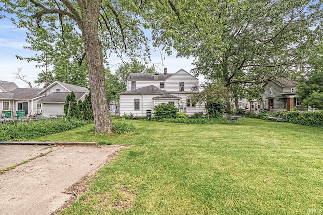 422 W Lawrence St, Mishawaka, IN 46545 - view of front of property featuring a front lawn and a chimney
