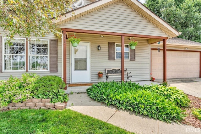3317 Jacob Pl, Lafayette, IN 47909 - view of front of house featuring an attached garage, covered porch, and concrete driveway