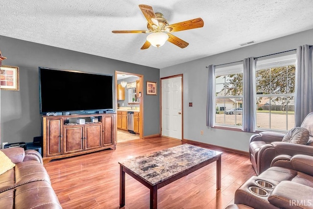 3317 Jacob Pl, Lafayette, IN 47909 - living area with a ceiling fan, a textured ceiling, and light wood-type flooring