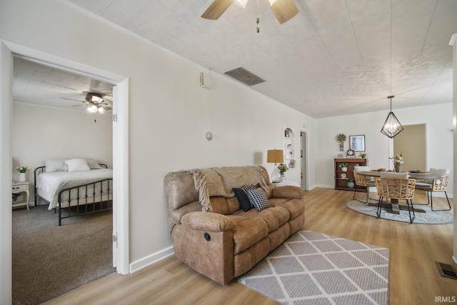 701 E N St, Kokomo, IN 46901 - living area featuring a ceiling fan and wood finished floors