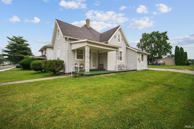 701 E N St, Kokomo, IN 46901 - view of front of property with a chimney, a front yard, and roof with shingles