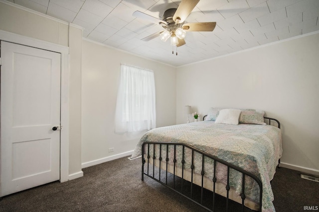 701 E N St, Kokomo, IN 46901 - bedroom featuring ornamental molding, dark carpet, and a ceiling fan