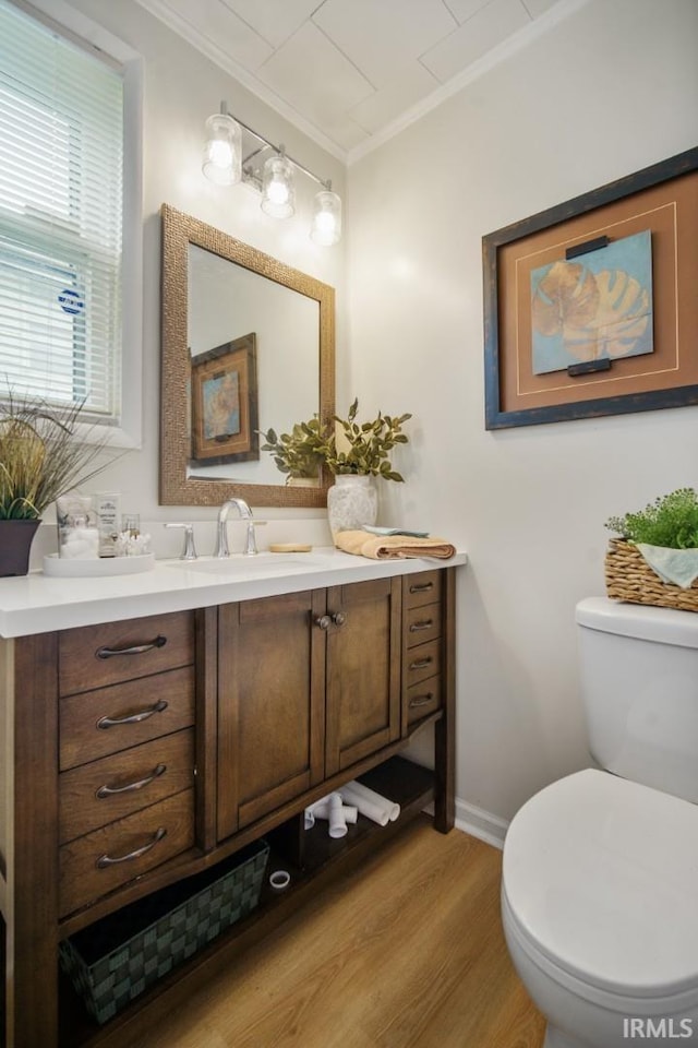 701 E N St, Kokomo, IN 46901 - half bath with vanity, wood finished floors, and ornamental molding