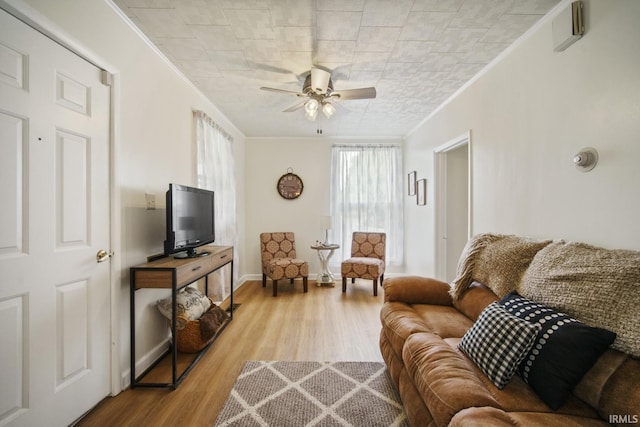 701 E N St, Kokomo, IN 46901 - living room featuring crown molding, wood finished floors, and ceiling fan