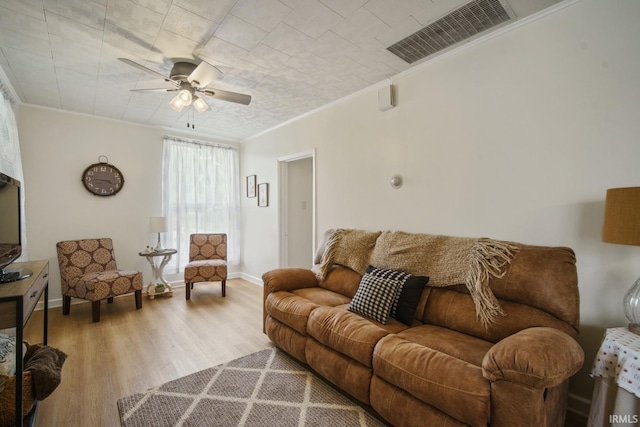 701 E N St, Kokomo, IN 46901 - living room featuring crown molding, wood finished floors, and a ceiling fan