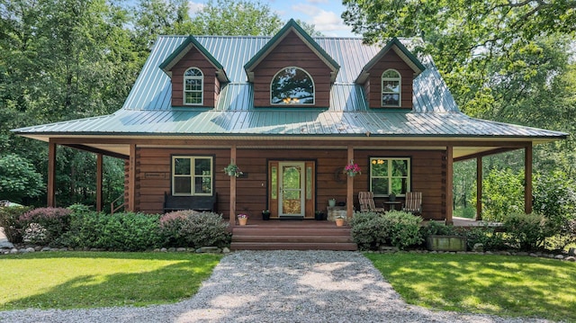 5618 N 725 E, Fremont, IN 46737 - view of front of property featuring covered porch, a front lawn, and a metal roof