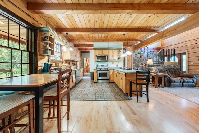 5618 N 725 E, Fremont, IN 46737 - kitchen with stainless steel appliances, open shelves, open floor plan, a peninsula, and light wood-style flooring
