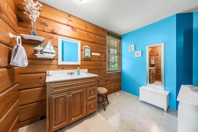 5618 N 725 E, Fremont, IN 46737 - bathroom featuring tile patterned floors, vanity, and wooden walls