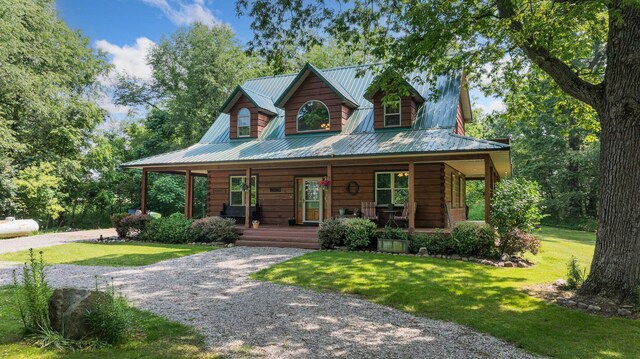 5618 N 725 E, Fremont, IN 46737 - view of front of property with a porch, a metal roof, a front lawn, and gravel driveway