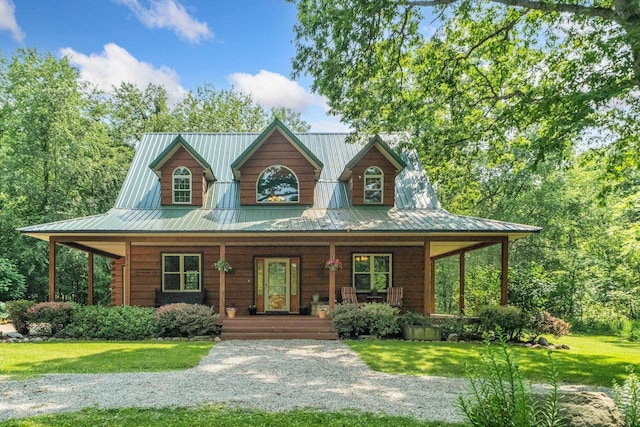 5618 N 725 E, Fremont, IN 46737 - view of front facade featuring a porch, a front lawn, and a metal roof