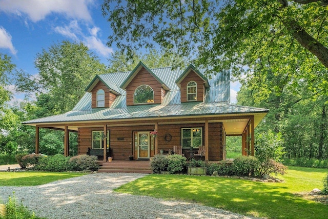 5618 N 725 E, Fremont, IN 46737 - view of front of house featuring covered porch, a metal roof, log exterior, and a front lawn