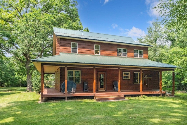 5618 N 725 E, Fremont, IN 46737 - rear view of property with a metal roof, a lawn, and a porch