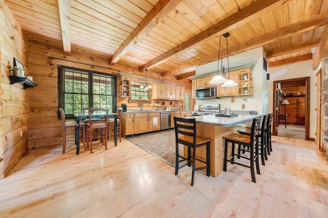 5618 N 725 E, Fremont, IN 46737 - kitchen with open shelves, appliances with stainless steel finishes, a wooden ceiling with exposed beams, a breakfast bar area, and light wood-style floors