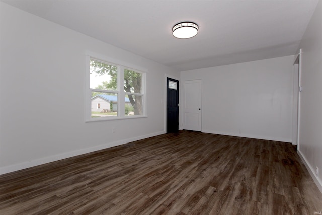 651 W Maple St, Wabash, IN 46992 - empty room featuring dark wood-style flooring and baseboards