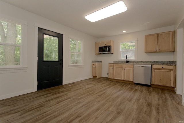 651 W Maple St, Wabash, IN 46992 - kitchen featuring appliances with stainless steel finishes, light brown cabinets, and light wood-style floors