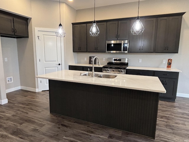 1544 Cananea Way, Fort Wayne, IN 46845 - kitchen with stainless steel appliances, dark wood finished floors, decorative light fixtures, and an island with sink