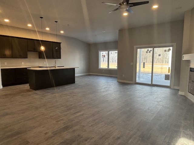 1544 Cananea Way, Fort Wayne, IN 46845 - kitchen with ceiling fan, open floor plan, a fireplace, a kitchen island with sink, and recessed lighting