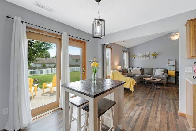 9536 Ballymore Dr, Fort Wayne, IN 46835 - dining area with dark wood-style floors, vaulted ceiling, and a ceiling fan