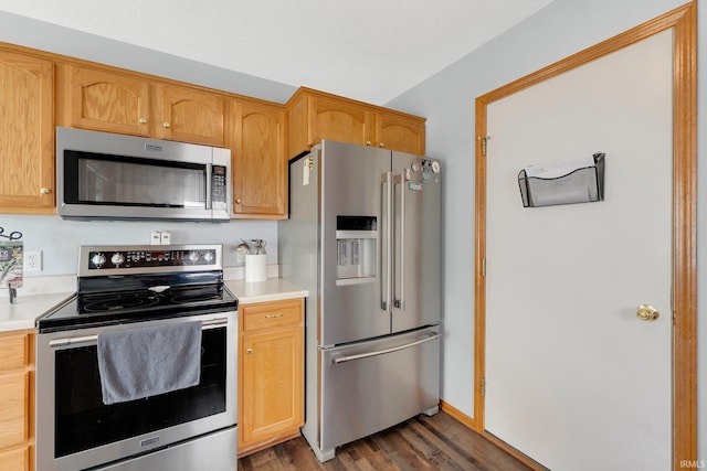 9536 Ballymore Dr, Fort Wayne, IN 46835 - kitchen with appliances with stainless steel finishes, light countertops, and wood finished floors