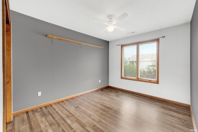 9536 Ballymore Dr, Fort Wayne, IN 46835 - unfurnished room featuring a ceiling fan and wood finished floors