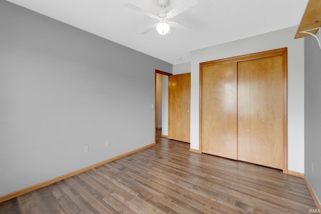 9536 Ballymore Dr, Fort Wayne, IN 46835 - unfurnished bedroom featuring wood finished floors, a closet, and ceiling fan