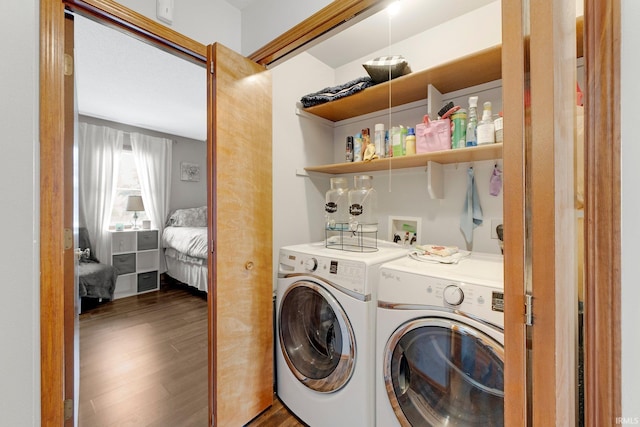 9536 Ballymore Dr, Fort Wayne, IN 46835 - laundry area with washing machine and clothes dryer and dark wood-style floors