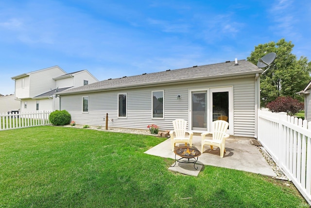 9536 Ballymore Dr, Fort Wayne, IN 46835 - rear view of house featuring a patio, a fenced backyard, and an outdoor fire pit