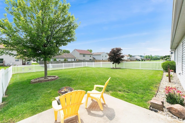 9536 Ballymore Dr, Fort Wayne, IN 46835 - fenced backyard with an outdoor fire pit, a patio area, and a residential view