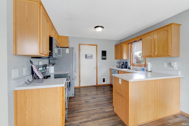 9536 Ballymore Dr, Fort Wayne, IN 46835 - kitchen featuring stainless steel microwave, electric range oven, a peninsula, wood finished floors, and light countertops