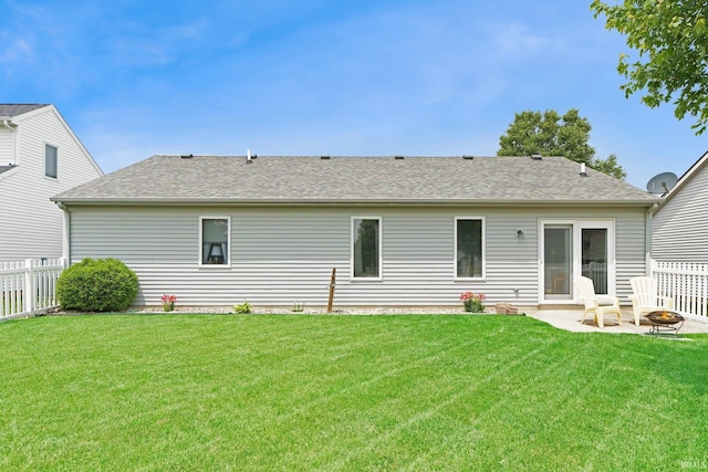 9536 Ballymore Dr, Fort Wayne, IN 46835 - rear view of house featuring a fire pit, a patio, and a shingled roof