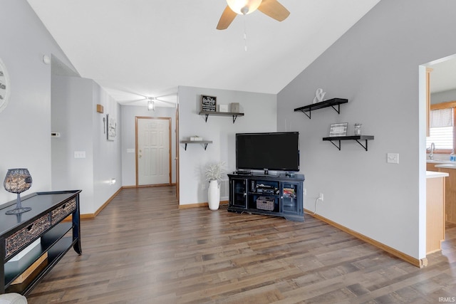 9536 Ballymore Dr, Fort Wayne, IN 46835 - unfurnished living room featuring a ceiling fan, wood finished floors, and vaulted ceiling