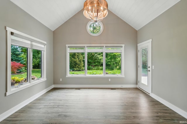 126 Tumbling Stone Ct, Fort Wayne, IN 46845 - empty room featuring a chandelier, lofted ceiling, and wood finished floors