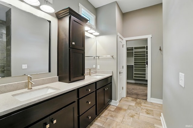 126 Tumbling Stone Ct, Fort Wayne, IN 46845 - full bath with double vanity, a spacious closet, and stone finish floors
