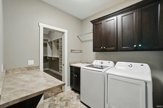 126 Tumbling Stone Ct, Fort Wayne, IN 46845 - laundry area with cabinet space, independent washer and dryer, light stone finish flooring, and a textured ceiling