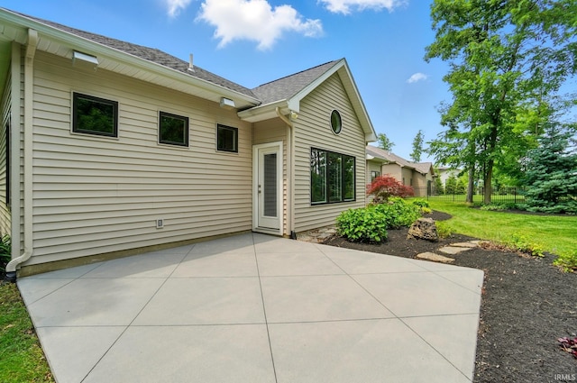 126 Tumbling Stone Ct, Fort Wayne, IN 46845 - back of property featuring a patio area and a shingled roof
