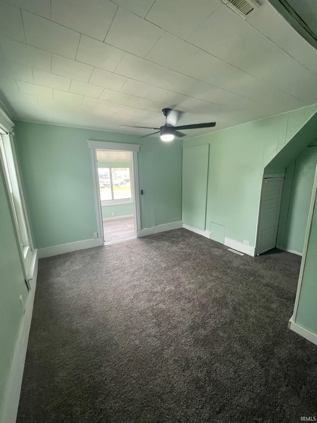 310 S Jefferson St, Bicknell, IN 47512 - empty room featuring dark colored carpet and ceiling fan