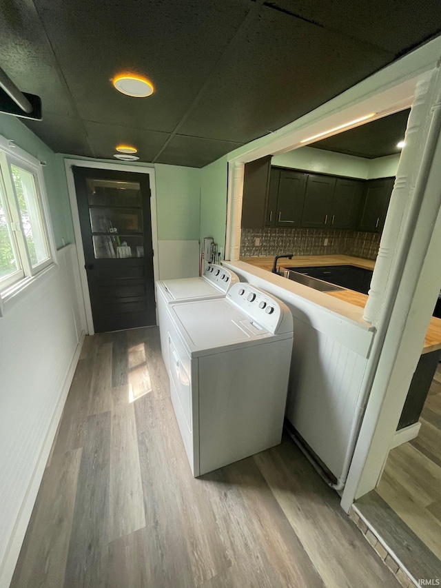 310 S Jefferson St, Bicknell, IN 47512 - washroom with washer and clothes dryer and light wood-style floors