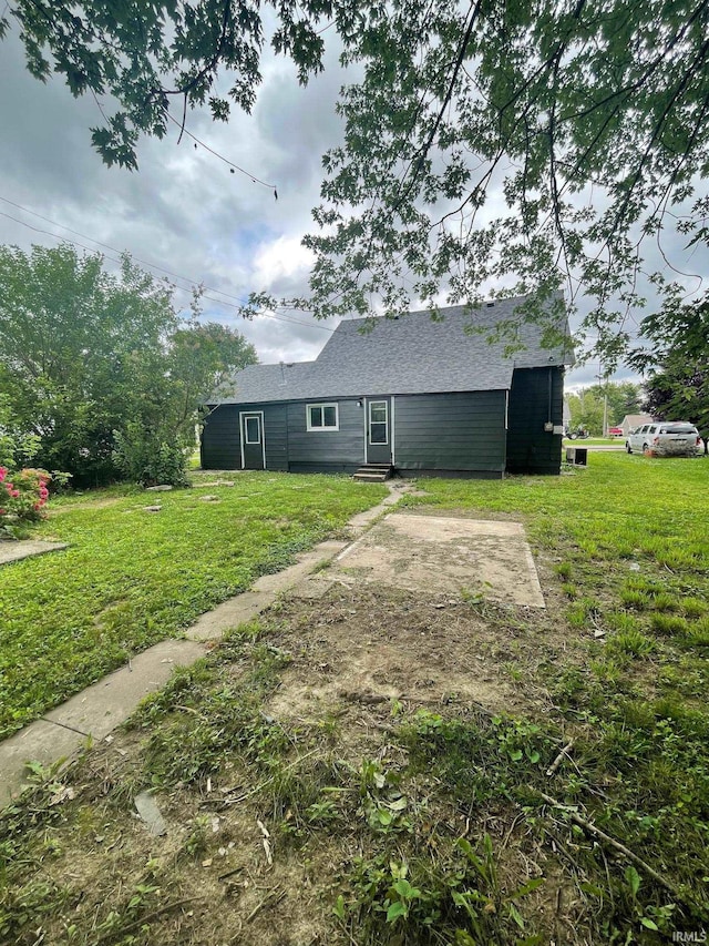 310 S Jefferson St, Bicknell, IN 47512 - back of property featuring a lawn and entry steps
