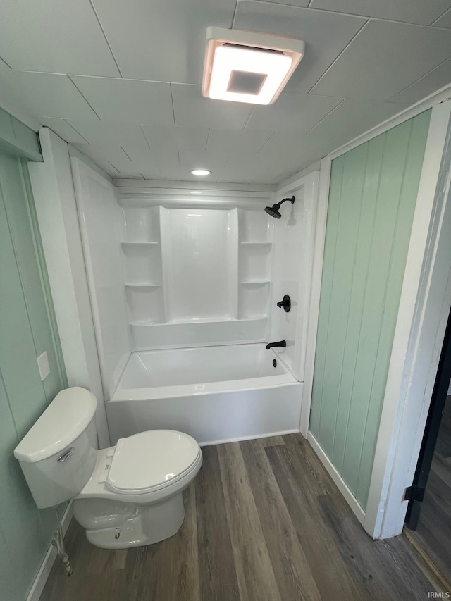 310 S Jefferson St, Bicknell, IN 47512 - bathroom with wood finished floors and bathtub / shower combination