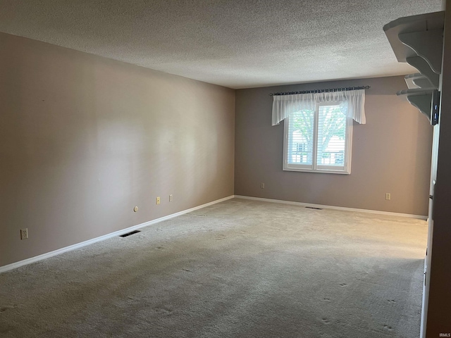 4501 N Wheeling Ave, Muncie, IN 47304 - carpeted empty room featuring a textured ceiling and baseboards