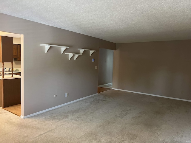 4501 N Wheeling Ave, Muncie, IN 47304 - unfurnished room featuring light colored carpet and a textured ceiling