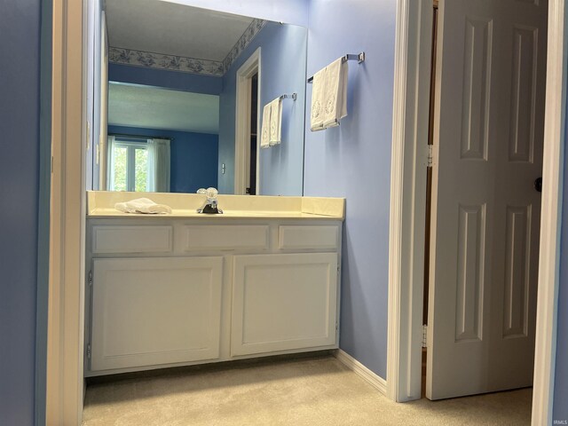 4501 N Wheeling Ave, Muncie, IN 47304 - bathroom with vanity and baseboards